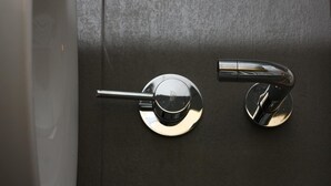 A door with a modern, metallic handle and a keyhole. - Kazas Luxury Apartments (Gortynia)