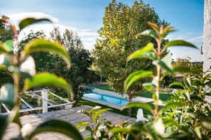 Seasonal outdoor pool, pool umbrellas, pool loungers