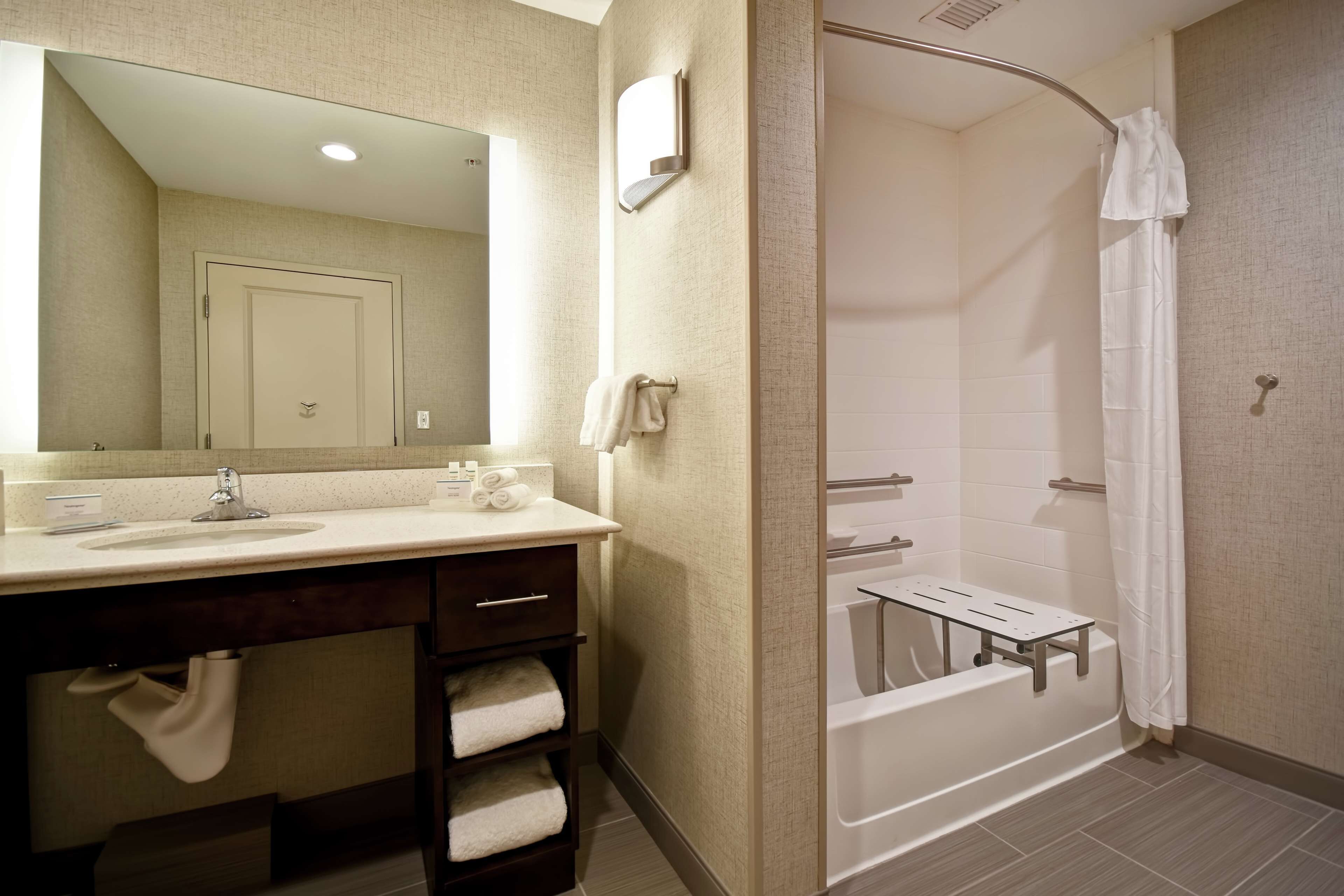 designer toiletries, hair dryer, towels, soap