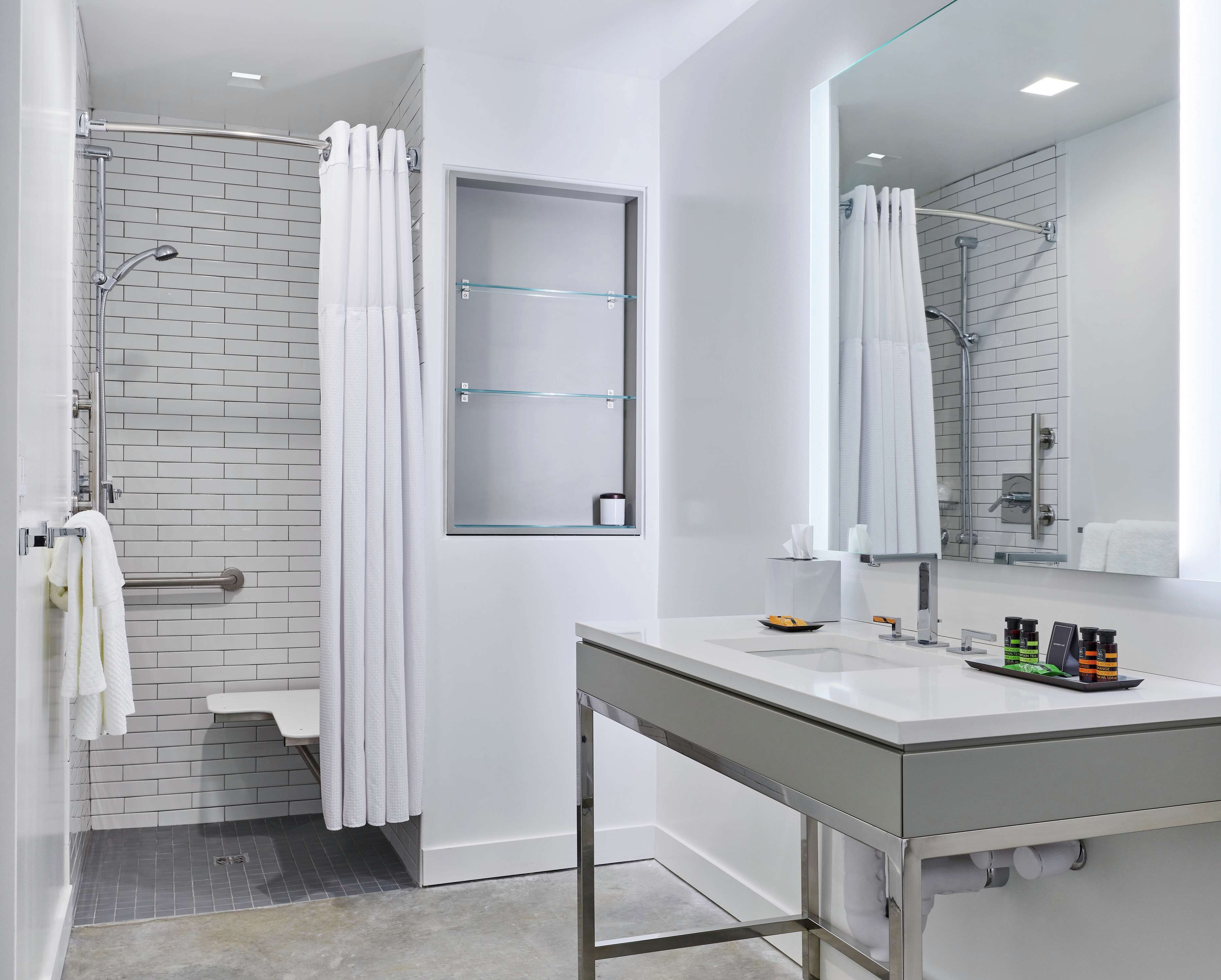 shower, designer toiletries, hair dryer, towels