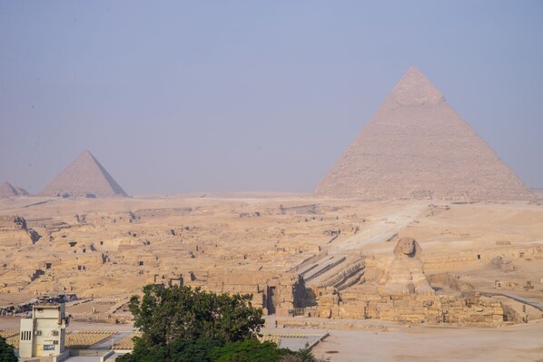 A view of the pyramids with a clear sky.