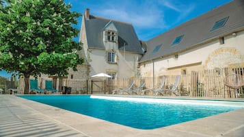 Outdoor pool, a heated pool, sun loungers