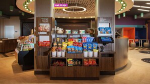 A 24/7 market kiosk with snacks and beverages. - Tru by Hilton Farmville (Farmville)