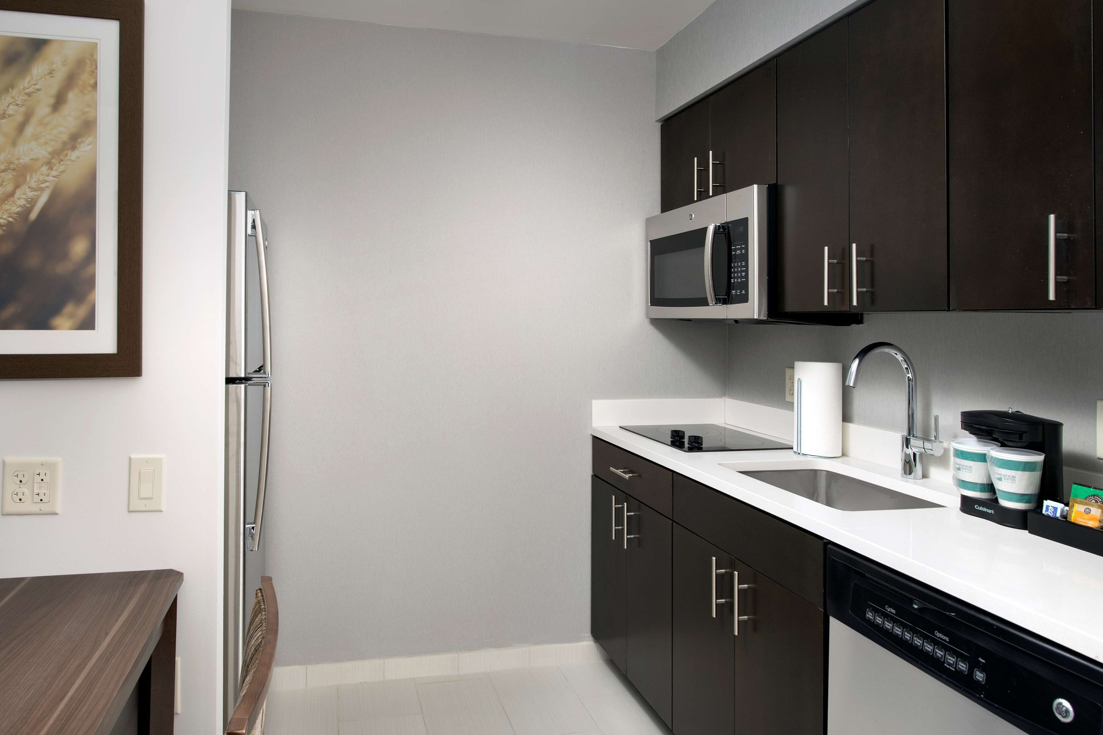 full-sized fridge, microwave, stovetop, dishwasher