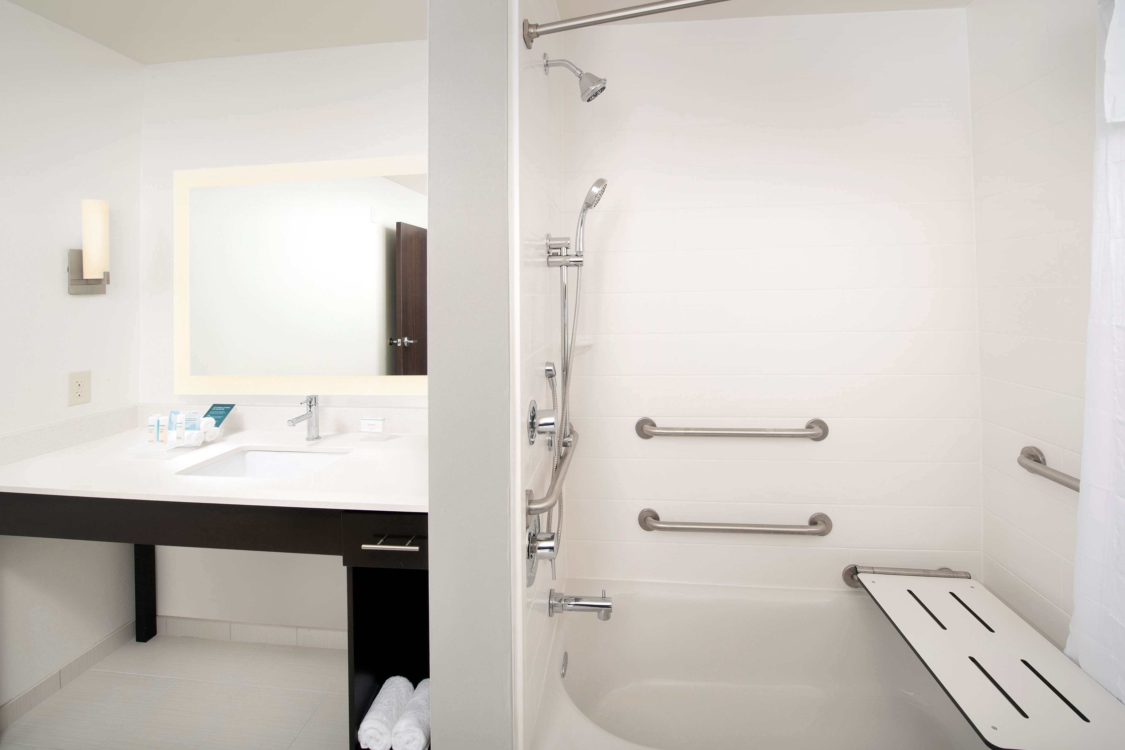 designer toiletries, hair dryer, towels