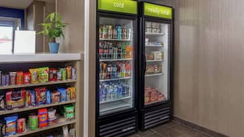 A refrigerated display with 'cold' and 'really cold' sections, stocked with beverages and snacks.