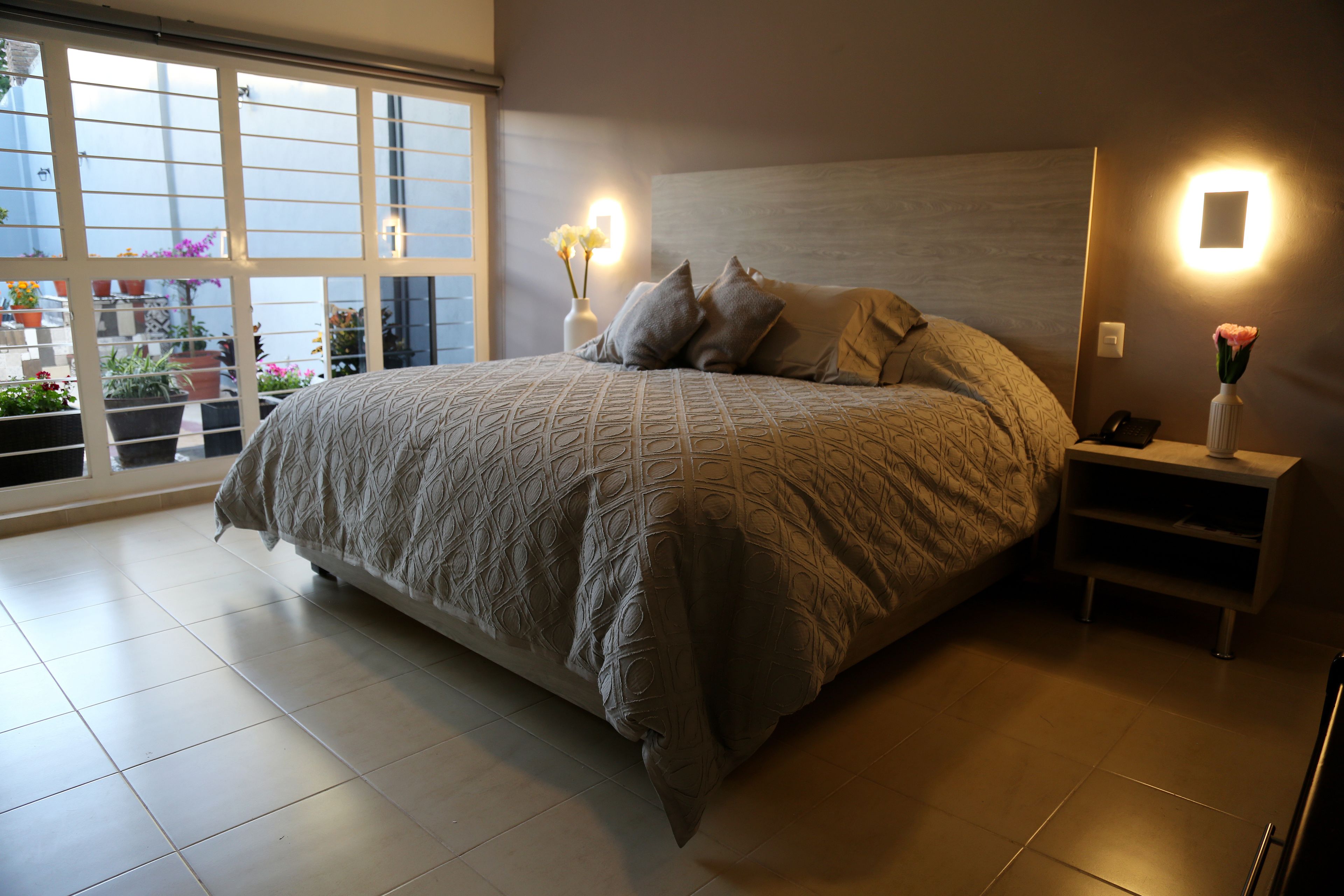 standard single room, 1 king bed | in-room safe, desk, iron/ironing board, free wifi