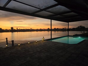 Outdoor pool, a heated pool - Escape to 80 ft Waterfront Luxury, Private Pier, Heated Pool, Jacuzzi, Bicycles! (Cape Coral)