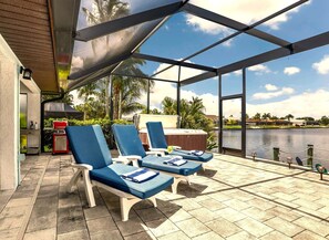 Terrace/patio - Lakefront Luxury Paradise: 80ft Waterfront, Private Pier & Heated Pool Oasis! (Cape Coral)