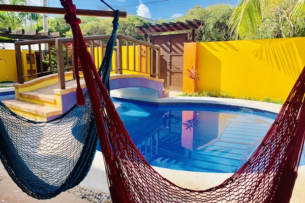 Lounging poolside hammocks. Perfect for hanging out, relaxing or a good book.