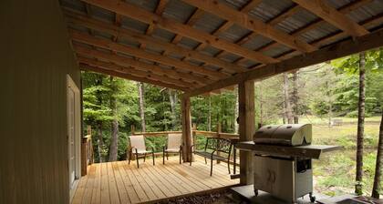 Private 50 ft waterfall. Eco-friendly, cozy shipping container cabin