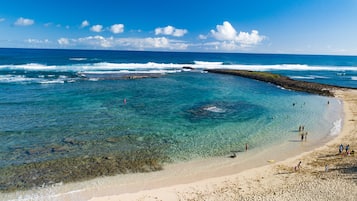 On the beach, sun-loungers, beach towels