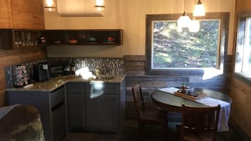Fridge, microwave, coffee/tea maker, cookware/dishes/utensils
