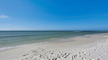 On the beach, sun loungers, beach towels