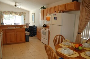 Fully equipped kitchen with eating area - Roomy and Comfy 3BR Villa South Facing Private Pool - Close to Disney Parks  (Kissimmee)