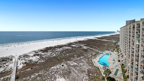 A high-rise hotel with a pool and beach view. - Escape to the Beach! Phoenix 8, 1402, 2 BR/2 Bath (Orange Beach)