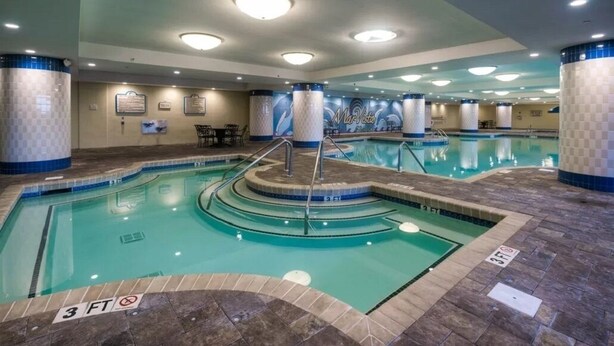 An indoor swimming pool with multiple lanes, a 3 FT depth marker, and a Mar Vista logo on the wall. - North Myrtle Beach Absolutely stunning condo unit 615 on the sixth floor (North Myrtle Beach)