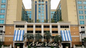 A hotel with a central tower, a blue and white striped awning, and the name 'Mar Vista' on the facade. - North Myrtle Beach Absolutely stunning condo unit 615 on the sixth floor (North Myrtle Beach)