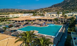 2 outdoor pools, open 8:00 AM to 7:00 PM, pool umbrellas, pool loungers