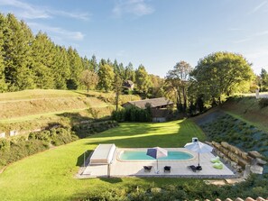 A heated pool, pool loungers