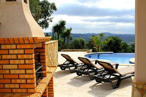 A heated pool, pool loungers