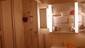 Shower, hair dryer, towels, toilet paper
