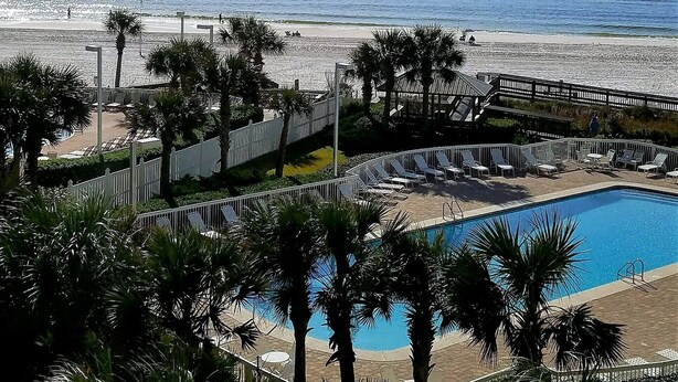 A resort with a pool, beach, and palm trees. - AUGUST REDUCED/SEPTEMBER AVAILABLE!! (Orange Beach)
