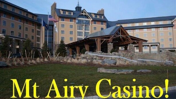 A large building with a prominent entrance and a sign that reads "Mt Airy Casino!" - Lakefront w Sauna/Hot Tub/Boats/Beach/Firepit/Pool table,close to Kalahari & Ski (Pocono Summit)