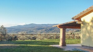 A building with a covered patio overlooking a mountainous landscape. - Tuscany: House "Old Abbey" among the olive trees with pool (Monteverdi Marittimo - PI -)