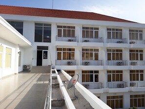 A multi-story building with a flat roof, large windows, and balconies. - Nha Khach Con Dao (Ho Chi Minh City)