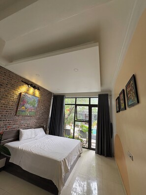 Deluxe-Doppelzimmer, 1 King-Bett, Gartenblick | Minibar, Schreibtisch, Verdunkelungsvorhänge, schallisolierte Zimmer