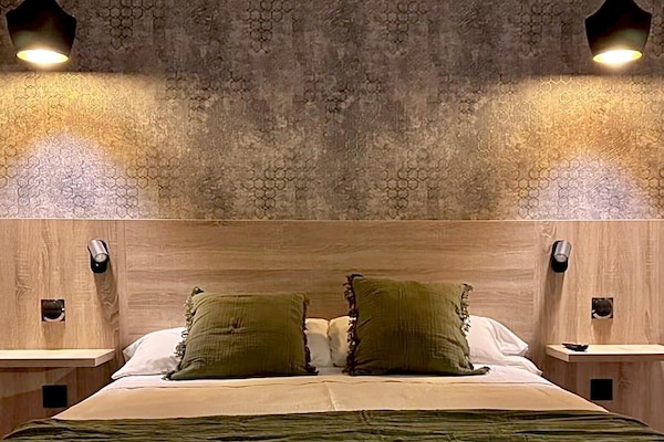 Down comforters, desk, blackout drapes, iron/ironing board