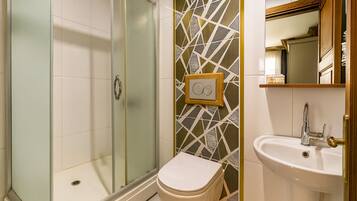 Shower, designer toiletries, hair dryer, slippers