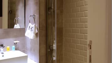 Family Suite, 1 Bedroom, Kitchenette | Bathroom | Rainfall showerhead, eco-friendly toiletries, hair dryer, towels