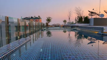 2 outdoor pools, pool umbrellas, pool loungers