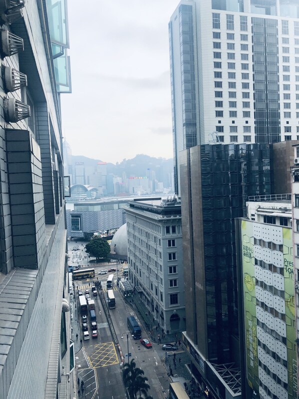 A high-rise building with a modern architectural design, featuring a mix of glass and concrete facades. - Kyoto Guest House (Kowloon)