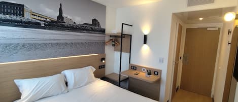 Desk, blackout drapes, WiFi (free), bed sheets