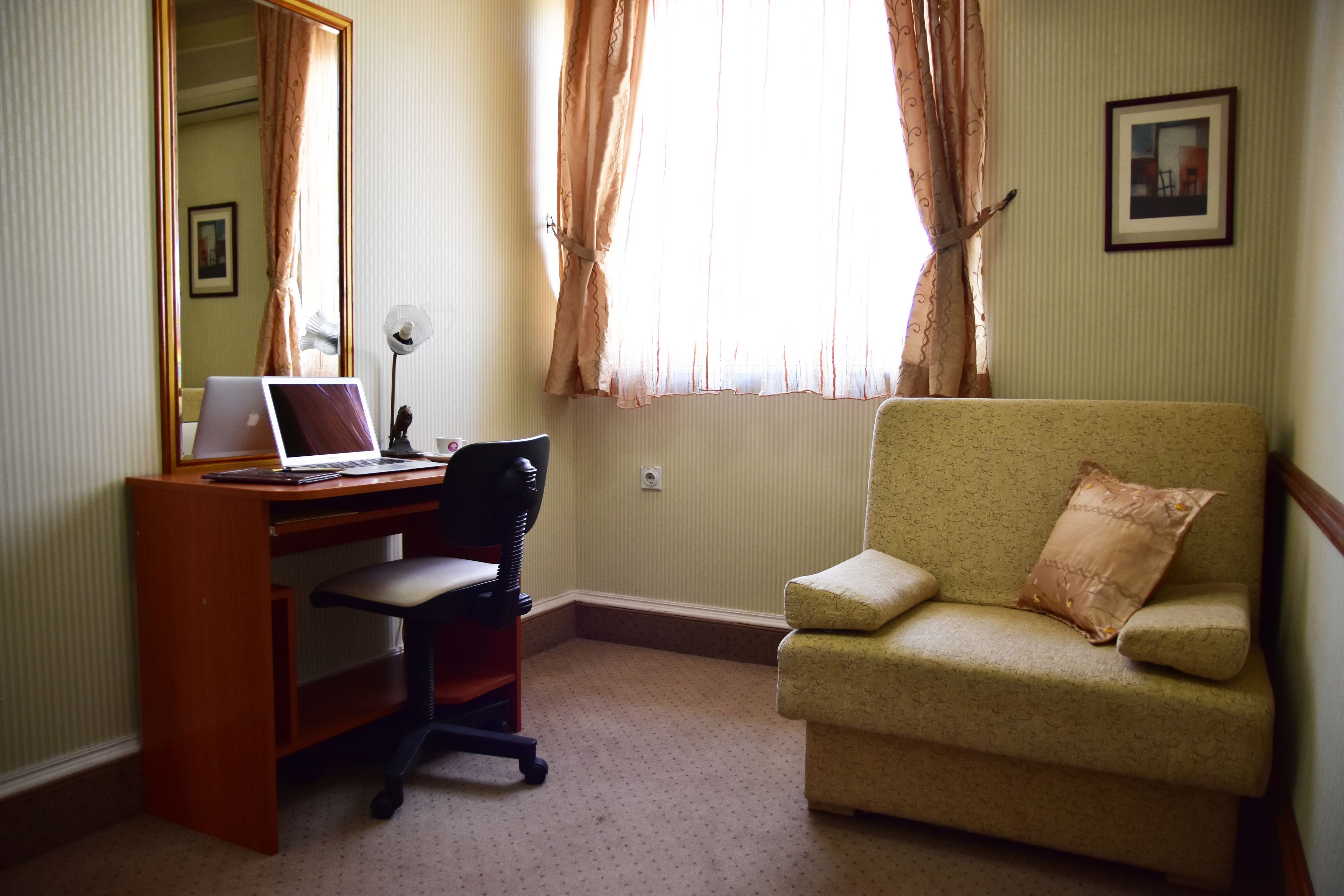 junior suite | living area | 32-inch flat-screen tv with cable channels, tv, heated floors