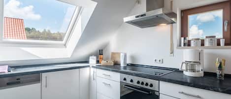 Comfort Apartment, Garden View (with living room & separate bedroom) | Private kitchen | Fridge, microwave, oven, stovetop