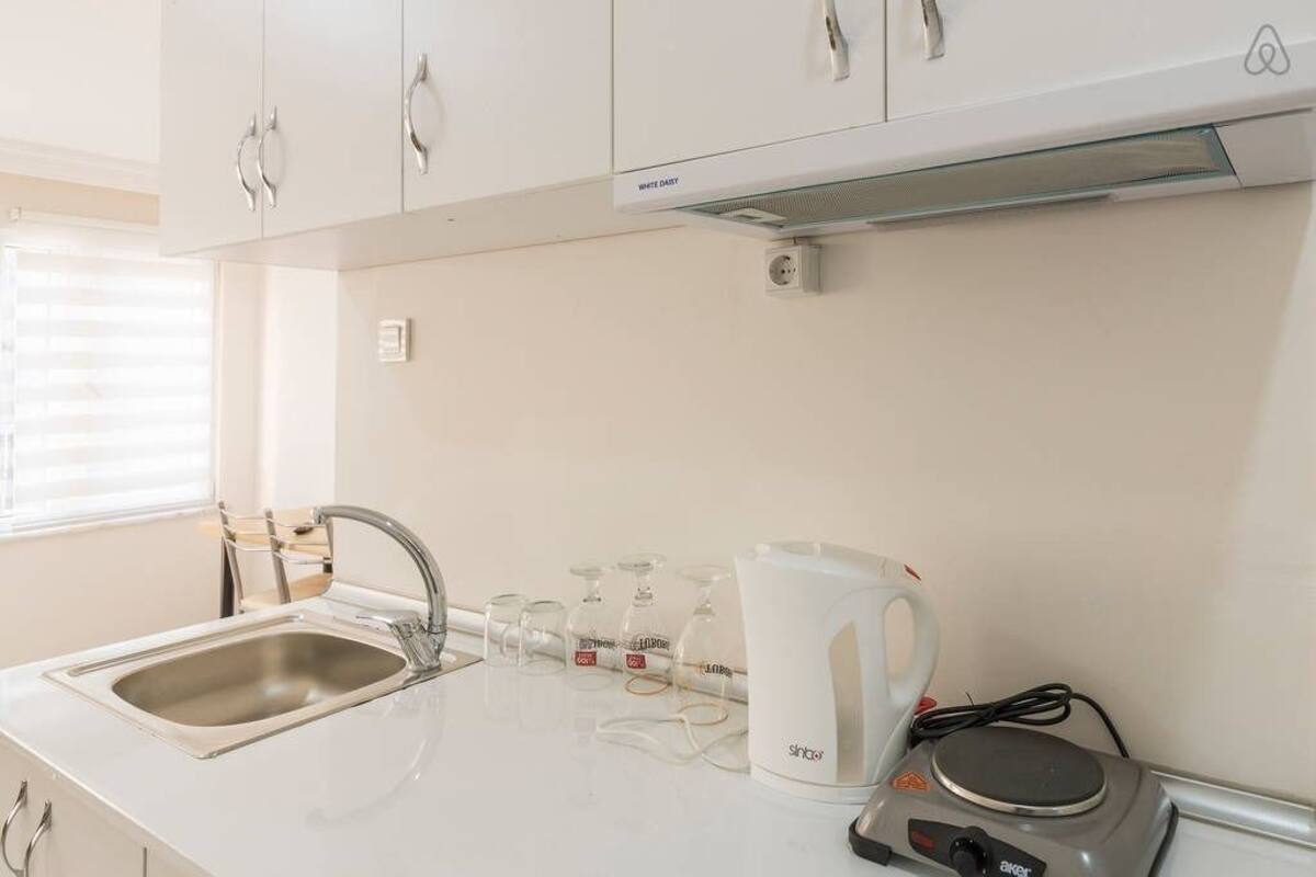 Fridge, stovetop, electric kettle, cookware/dishes/utensils
