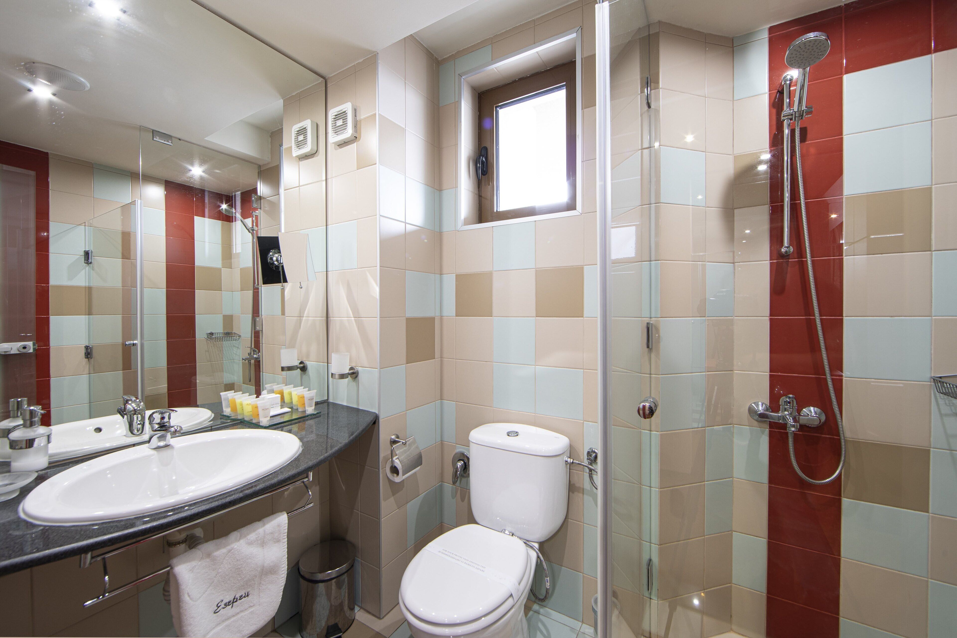deluxe junior suite | bathroom | free toiletries, hair dryer, bathrobes, slippers
