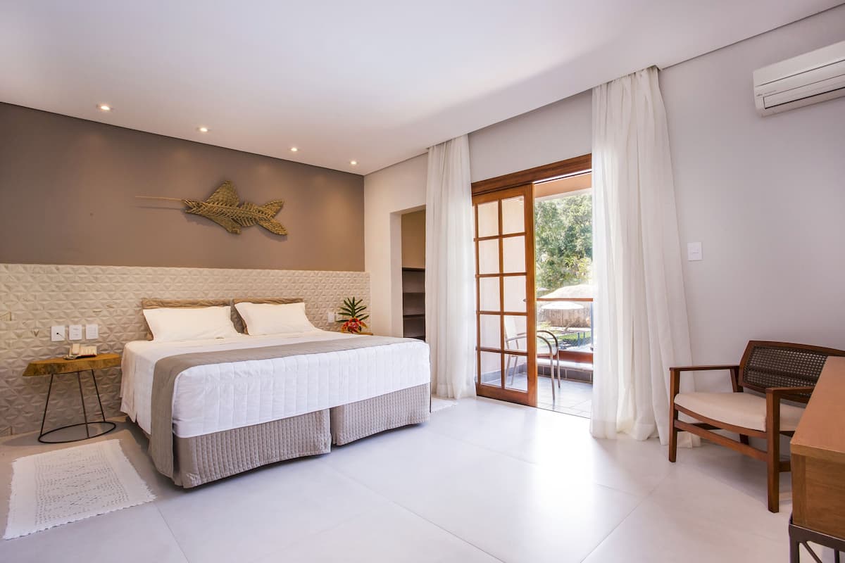 suíte luxo | 1 bedroom, minibar, in-room safe, blackout curtains