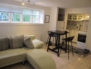 Family Suite | Living area | 52-inch flat-screen TV with satellite channels, TV, fireplace - Guesthouse Sharon Aarhus (Aarhus)