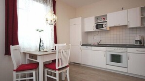 Condo, Balcony | Private kitchen | Coffee/tea maker, full-size fridge, microwave, oven - Villa & Haus Seydlitz (1RB11) (Binz)
