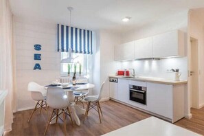 Apartment, 1 Bedroom, Balcony (42RB58) | Private kitchenette | Fridge, microwave, coffee/tea maker - Min Huesung Apartment (Binz)