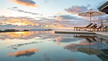 Outdoor pool, open 7:00 AM to 7:00 PM, pool umbrellas, pool loungers