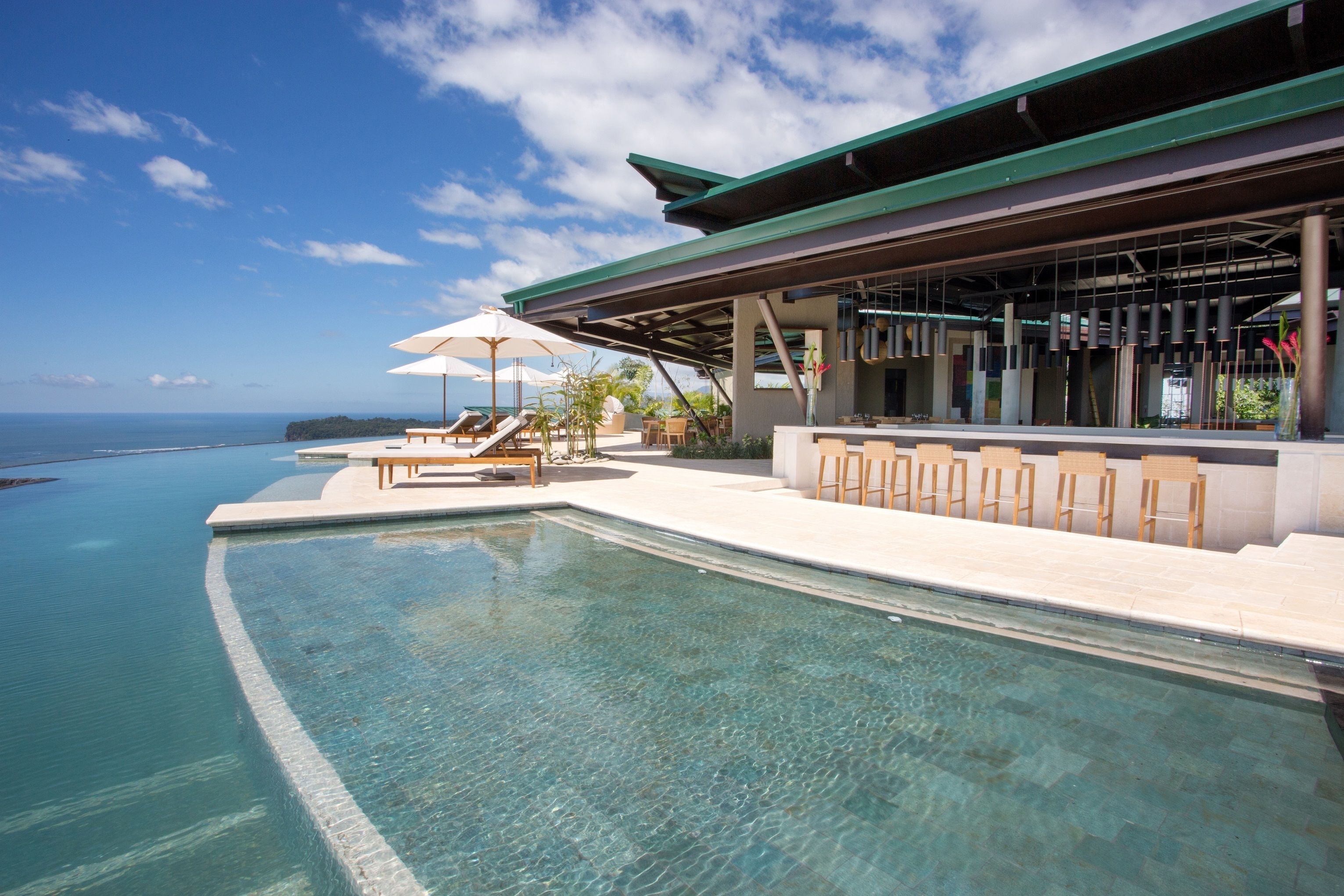 Outdoor pool, open 7:00 AM to 7:00 PM, pool umbrellas, sun loungers