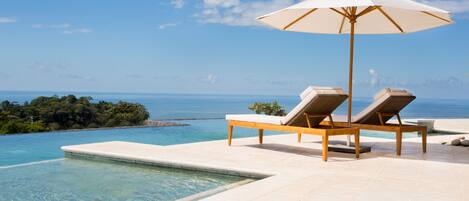 Outdoor pool, open 7:00 AM to 7:00 PM, pool umbrellas, sun loungers