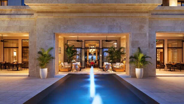 A hotel entrance with a central water feature, seating areas, and potted plants. - The Santa Maria, A Luxury Collection Hotel & Golf Resort, Panama City (Panama City)