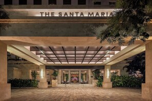 A hotel entrance with a sign reading 'THE SANTA MARIA' and a covered entrance area with columns and potted plants. - The Santa Maria, A Luxury Collection Hotel & Golf Resort, Panama City (Panama City)